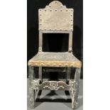 A William and Mary revival side chair, leather back and seat, rosette embossing, brass studs,