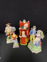 A 19th century Staffordshire pew group and three early figures, a/f