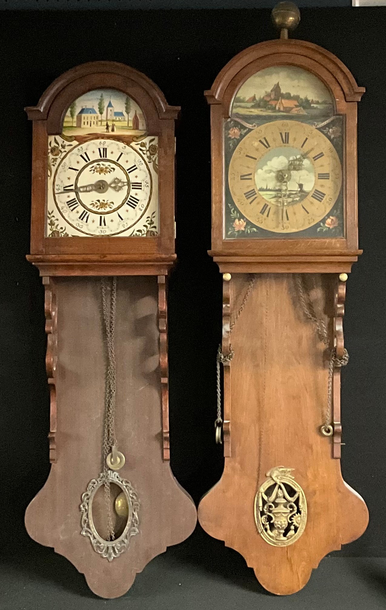 A 19th century Dutch hooded wall clock, the thirty hour movement with Solomonic pillars, 126cm