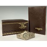 A lady's Tag Heuer stainless steel watch; a Longines box with wallet (2)