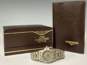 A lady's Tag Heuer stainless steel watch; a Longines box with wallet (2)