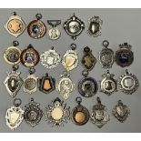 An Edwardian silver swimming award fob, Birmingham 1909, assorted other silver and enameled fobs,