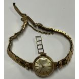 A lady's Bentima 9ct gold watch, Champagne dial, baton indicators, integral 9ct gold bracelet strap,