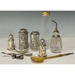 A George IV silver caddy spoon, Birmingham 1822, 8g; a George V silver gilt mounted dressing table