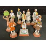 An Indian terracotta figure, servant with tray of fruit, hand painted, 13cm; others similar, scribe,