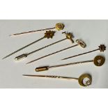 A late 19th century gold stick pin, set with a single diamond, unmarked, probably 9/15ct, 1.9g,