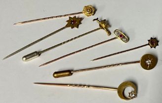 A late 19th century gold stick pin, set with a single diamond, unmarked, probably 9/15ct, 1.9g,