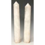 A pair of Rock crystal white quartz obelisks of slightly tapering hexagonal form, 29.5cm high and