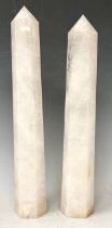 A pair of Rock crystal white quartz obelisks of slightly tapering hexagonal form, 29.5cm high and