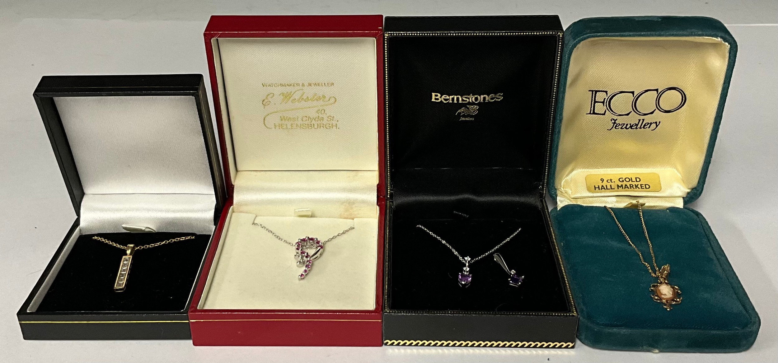 A 9ct white gold cubic zirconia pendant with necklace chain, marked 375, boxed, a similar 9ct