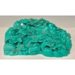 A contemporary Chinese composite ‘boulder’, moulded as faux-turquoise with a mountain-top landscape,