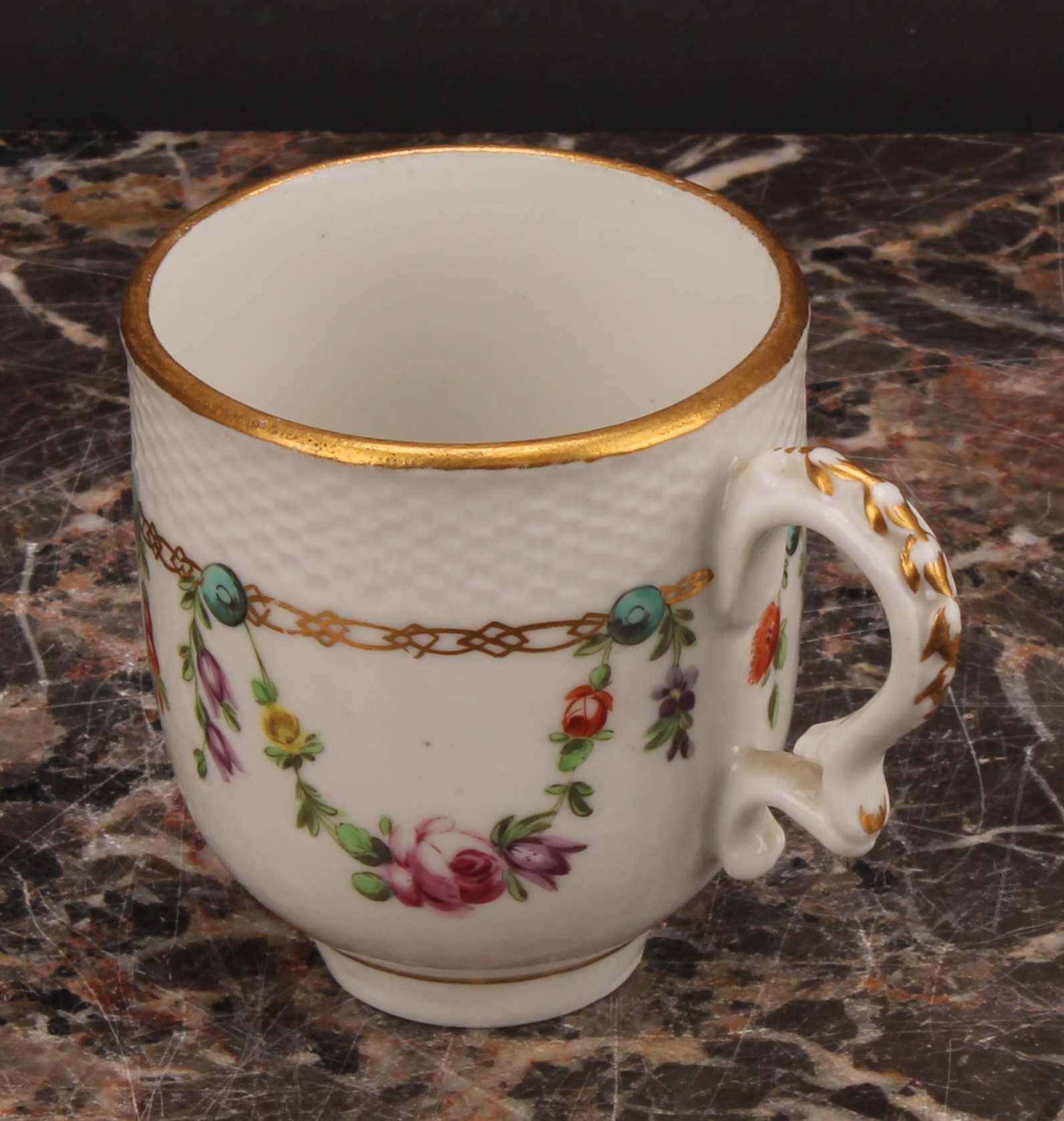 A Bristol coffee cup and saucer, basket weave moulded border, enamelled with polychrome swags - Image 6 of 9
