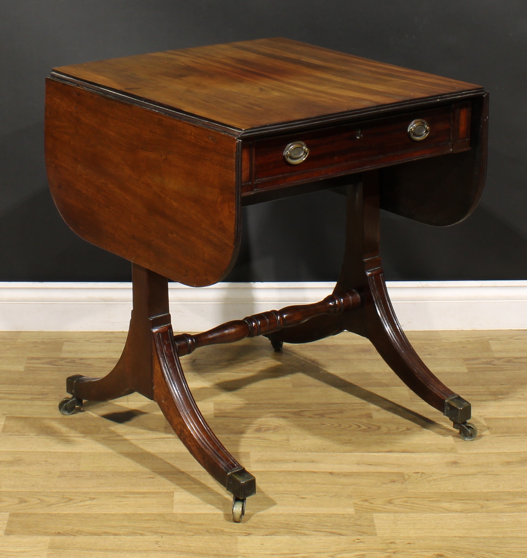 A 19th century mahogany sofa table, rounded rectangular top with fall leaves above a frieze - Image 4 of 7