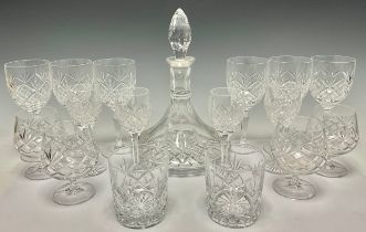 A quantity of cut glass comprising a ship’s decanter, diamond shaped stopper, 28cm high; four brandy