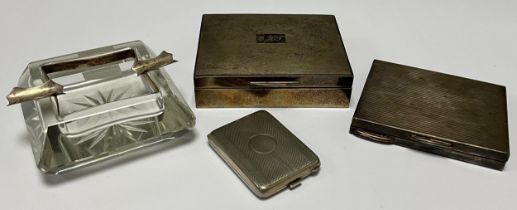 An Elizabeth II silver engine turned cigarette box, hinged cover with monogram, cedar wood lined,