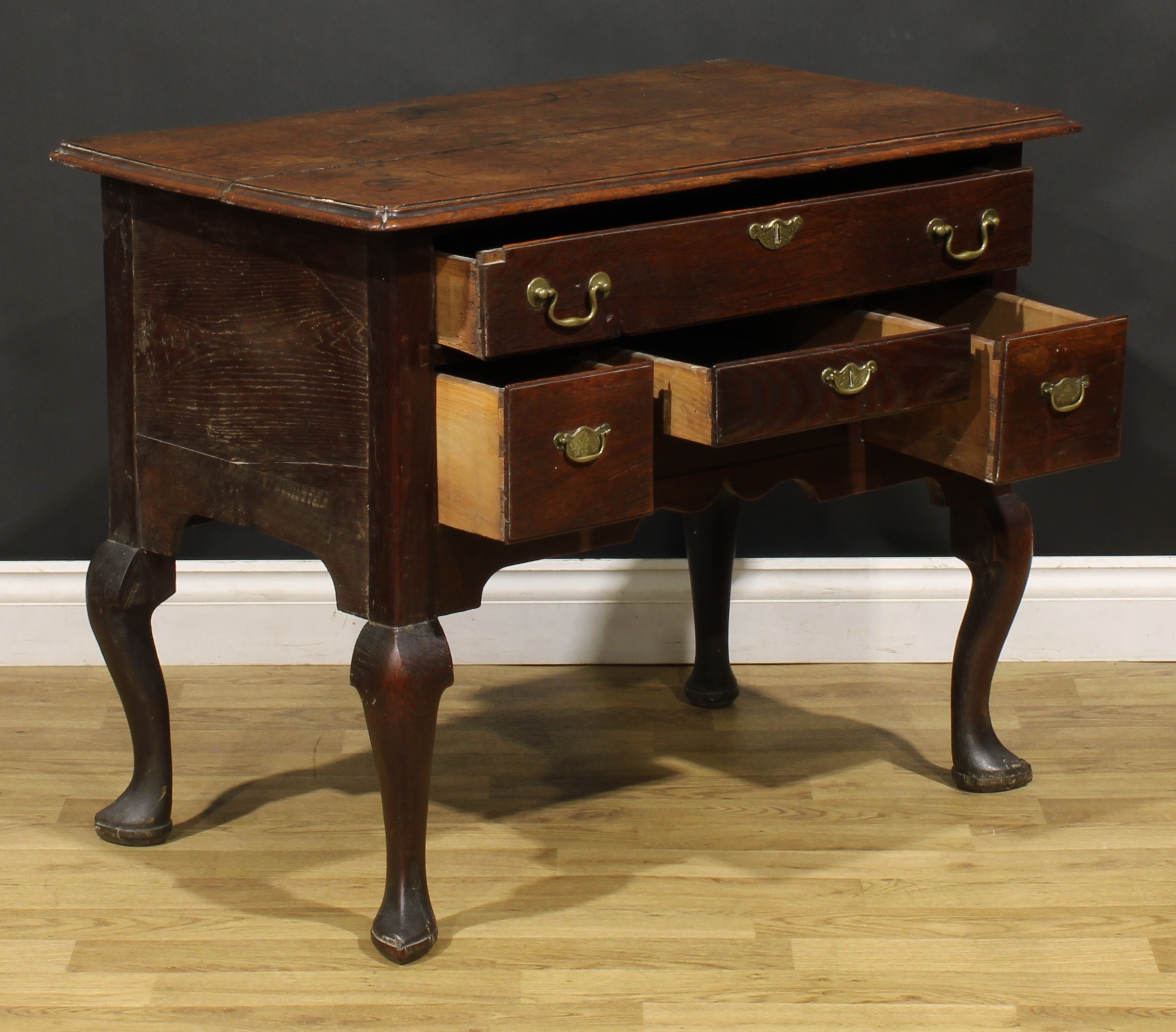 An 18th century oak lowboy, rectangular top with reentrant foreangles above four drawers, shaped - Image 4 of 6