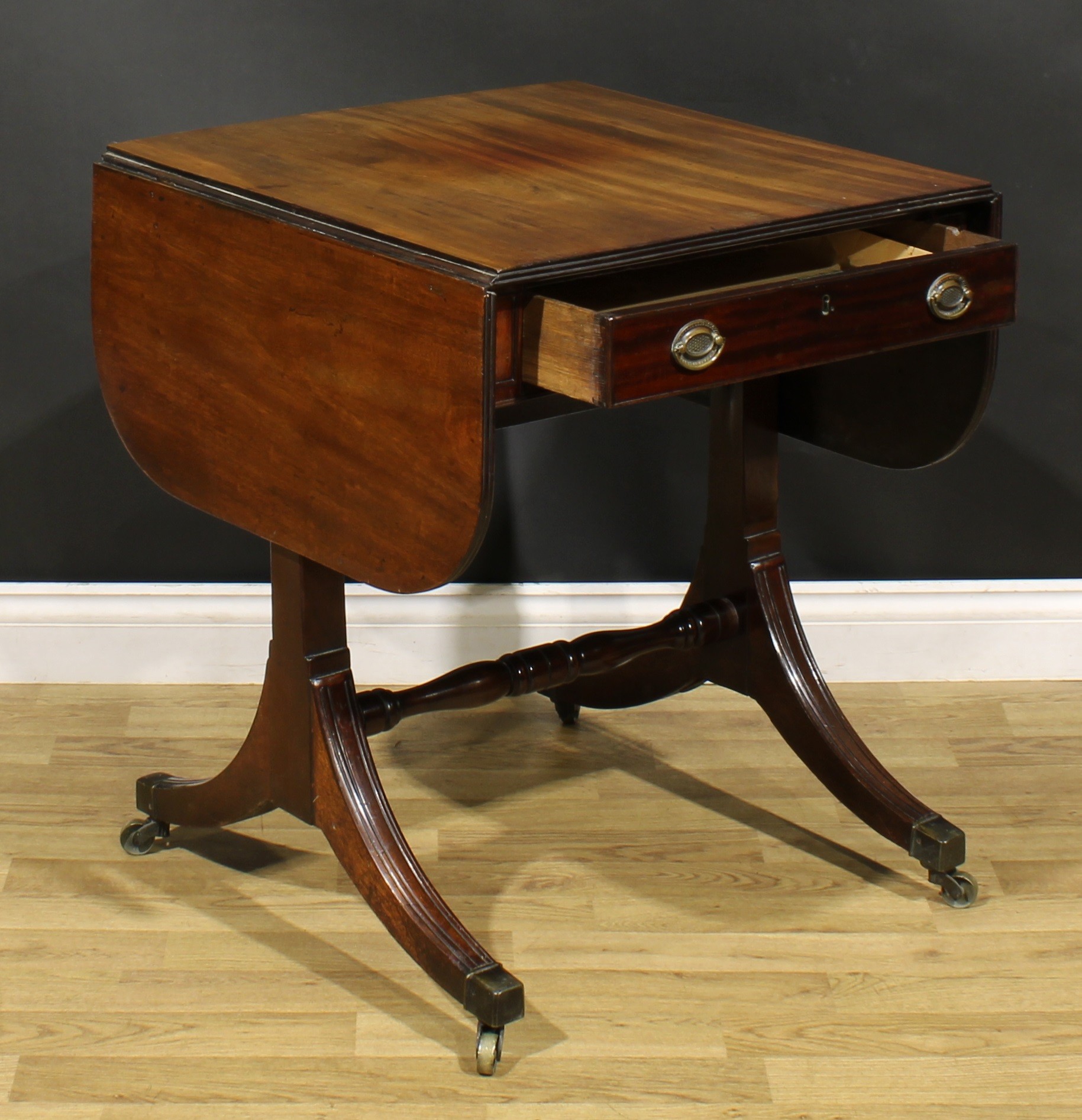 A 19th century mahogany sofa table, rounded rectangular top with fall leaves above a frieze - Image 5 of 7