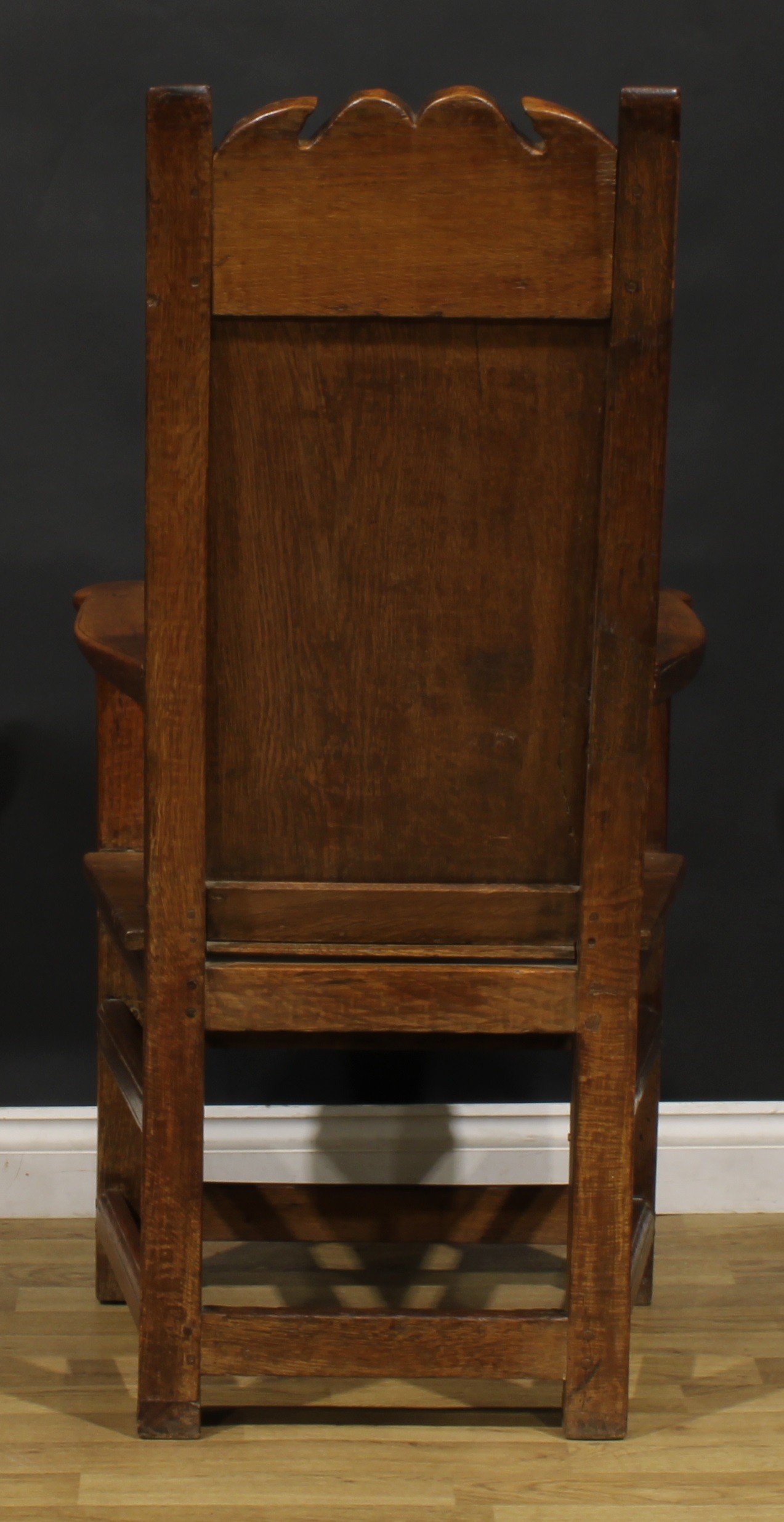 An 18th century and later oak and fruitwood caquetoire or panel-back armchair, possibly Scottish, - Image 4 of 4