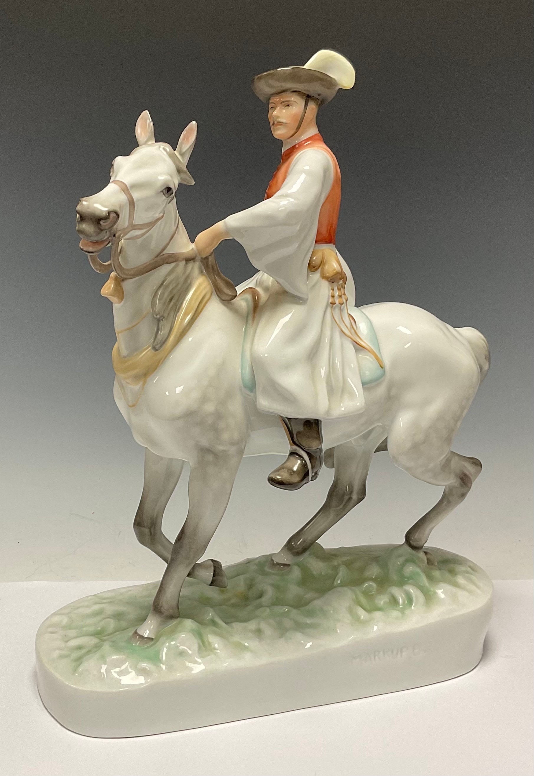 A large Herend porcelain figure by Markup Bela, man on horseback in traditional Hungarian dress,