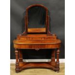 A Victorian mahogany duchess dressing table, arched rectangular mirror above three small drawers,