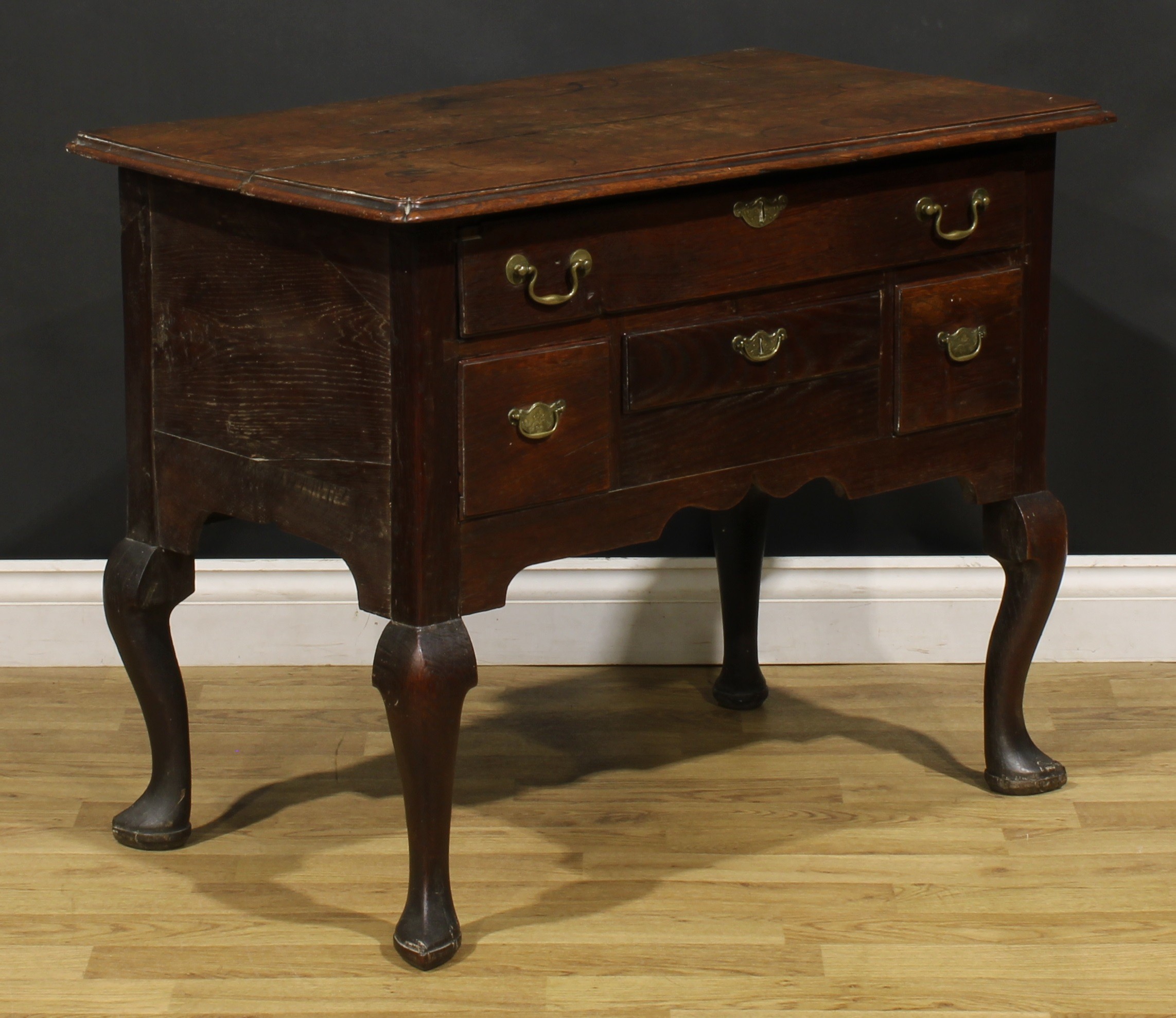 An 18th century oak lowboy, rectangular top with reentrant foreangles above four drawers, shaped - Image 3 of 6