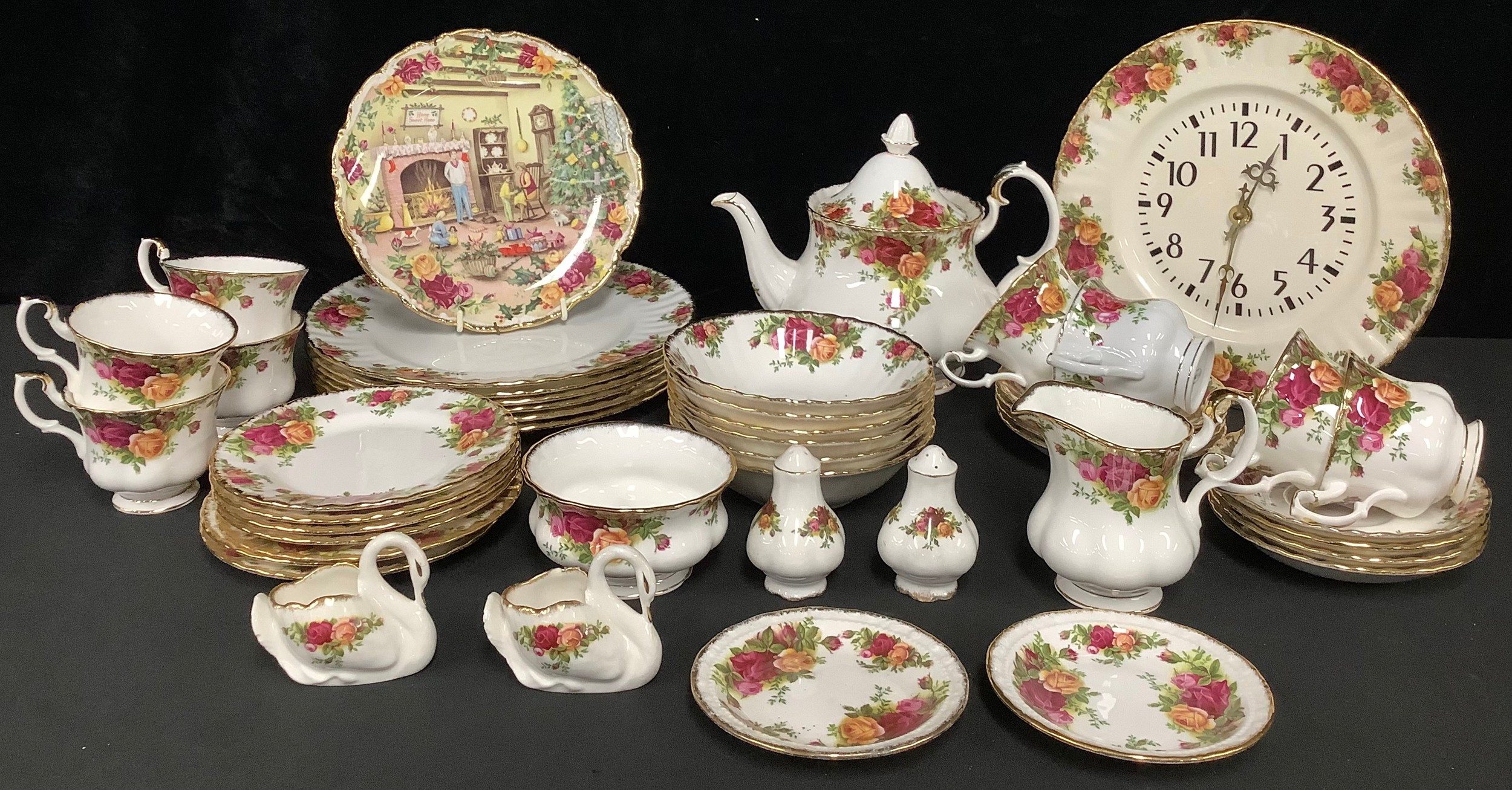 A Royal Albert Country Roses pattern tea service for six comprising teacups, saucers, teapot,