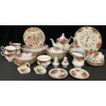 A Royal Albert Country Roses pattern tea service for six comprising teacups, saucers, teapot,