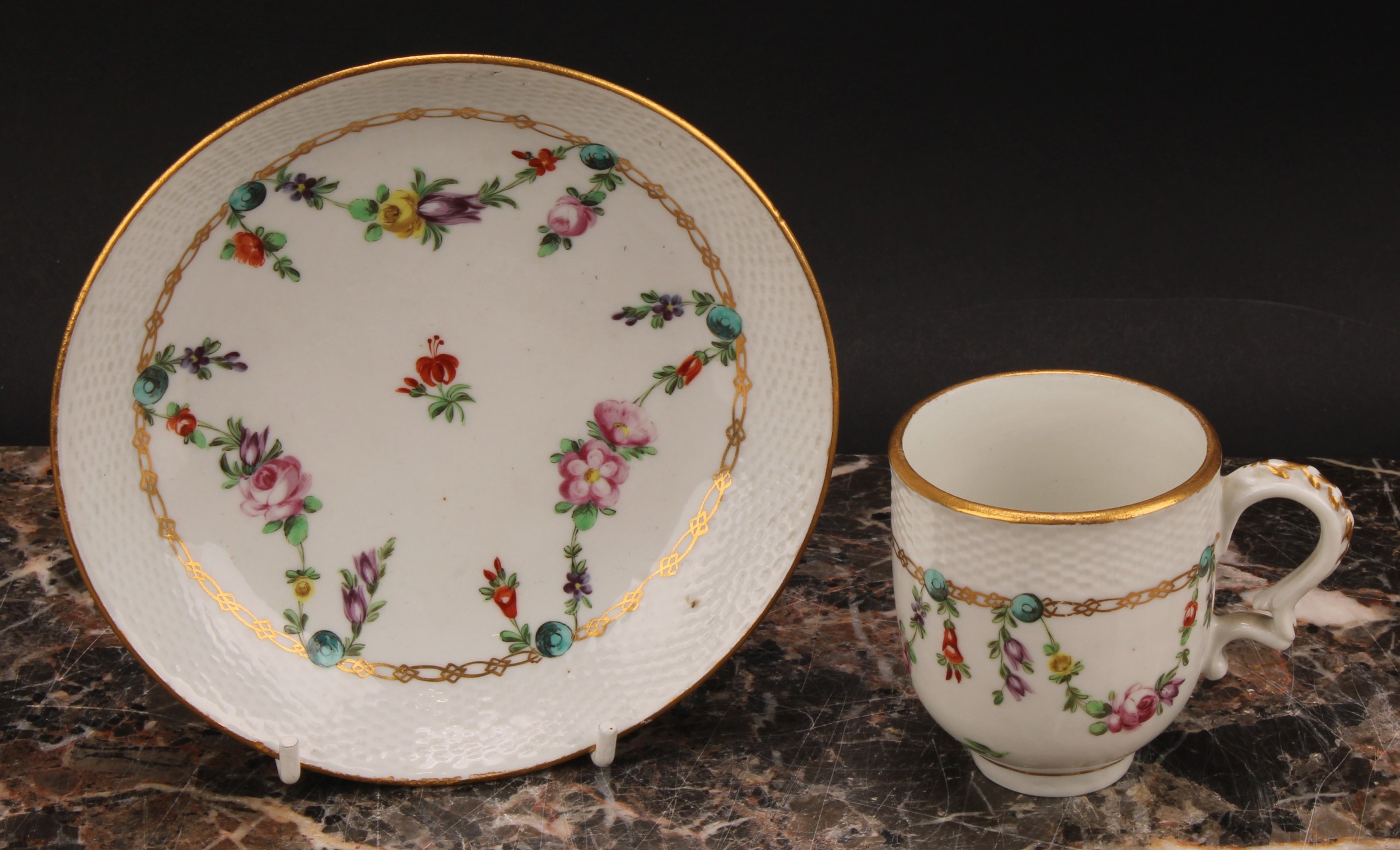 A Bristol coffee cup and saucer, basket weave moulded border, enamelled with polychrome swags - Image 3 of 9