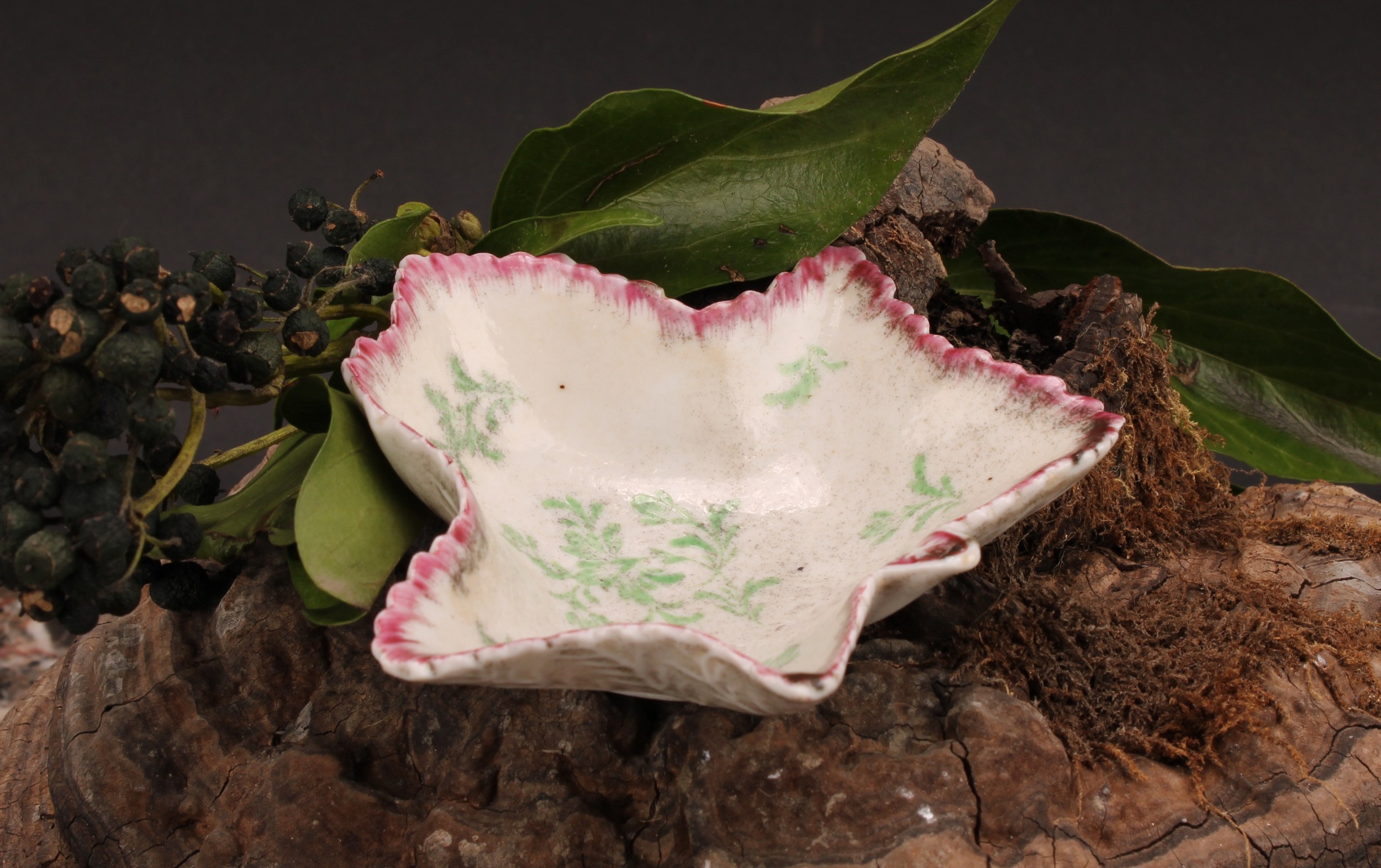 A rare early Plymouth leaf shaped pickle dish, painted in polychrome with scattered green leaves