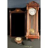 A 19th century style Vienna wall clock, 104cm high; a postman's type circular wall clock; an