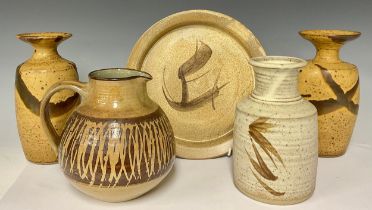 A pair of studio pottery stoneware shoulder vases, flared everted rims, drip glazed in mottled ochre