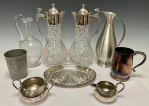 Silver Plate & Glass - A pair of cut glass claret jugs mounted with EPNS collar and lid, C-scroll