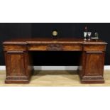 A William IV mahogany sideboard, inverted break-centre top above a pair of frieze drawers, carved to