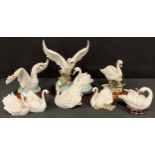 A Giuseppe Armani Florence resin model of a swan, wooden stand, 10cm; other similar resin swan