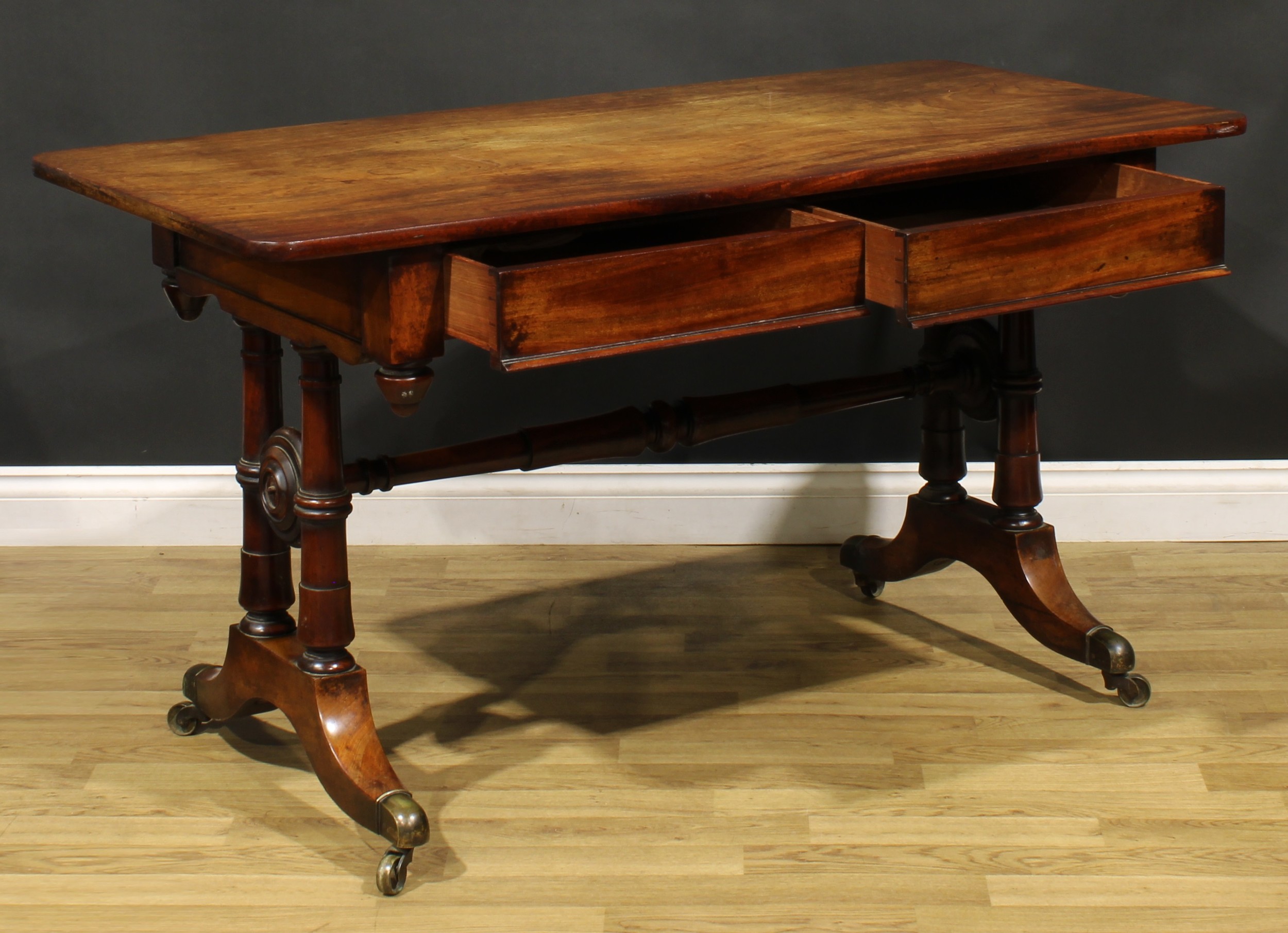A Post-Regency mahogany library table, rounded rectangular top above a pair of frieze drawers, - Image 4 of 6
