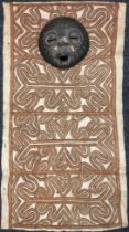 Tribal Art - a Papua New Guinea Tapa type cloth; a circular wall mask, inlaid with metal and