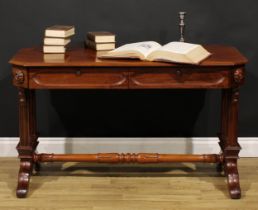 A Post-Regency Gothic Revival mahogany library table, canted rectangular top with moulded edge above