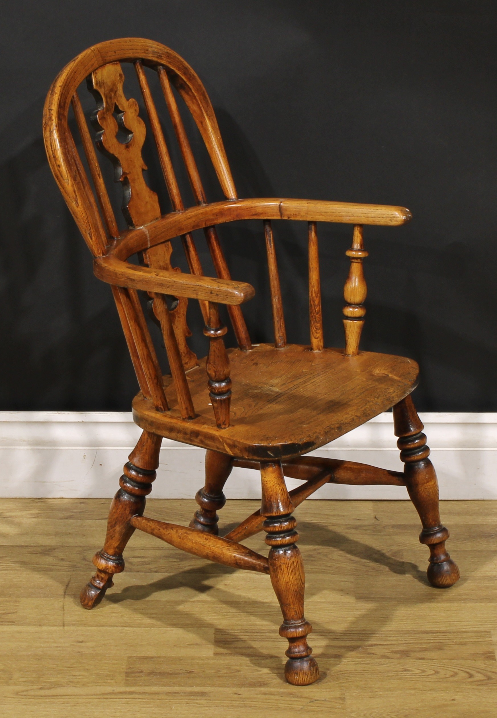 A 19th century ash and elm child’s Windsor elbow chair, pierced ‘Christmas tree’ splat, 67cm high, - Image 2 of 4