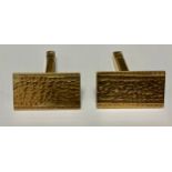 A pair of 9ct gold rectangular textured cuff links, milled borders, London 1968, 10.4g