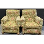 A pair of early 20th century country house easy chairs, stuffed-over upholstery, squab cushions,