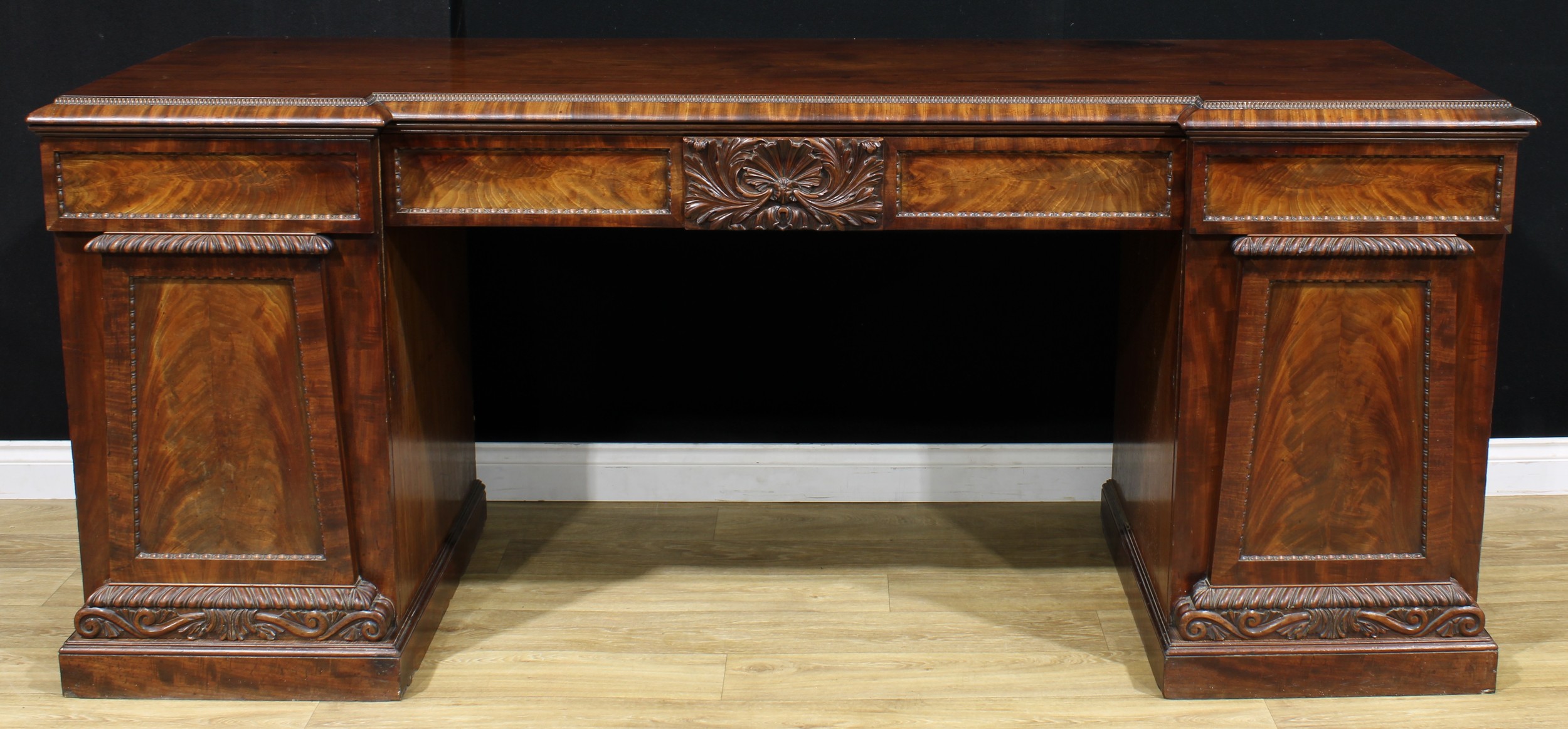 A William IV mahogany sideboard, inverted break-centre top above a pair of frieze drawers, carved to - Image 2 of 2