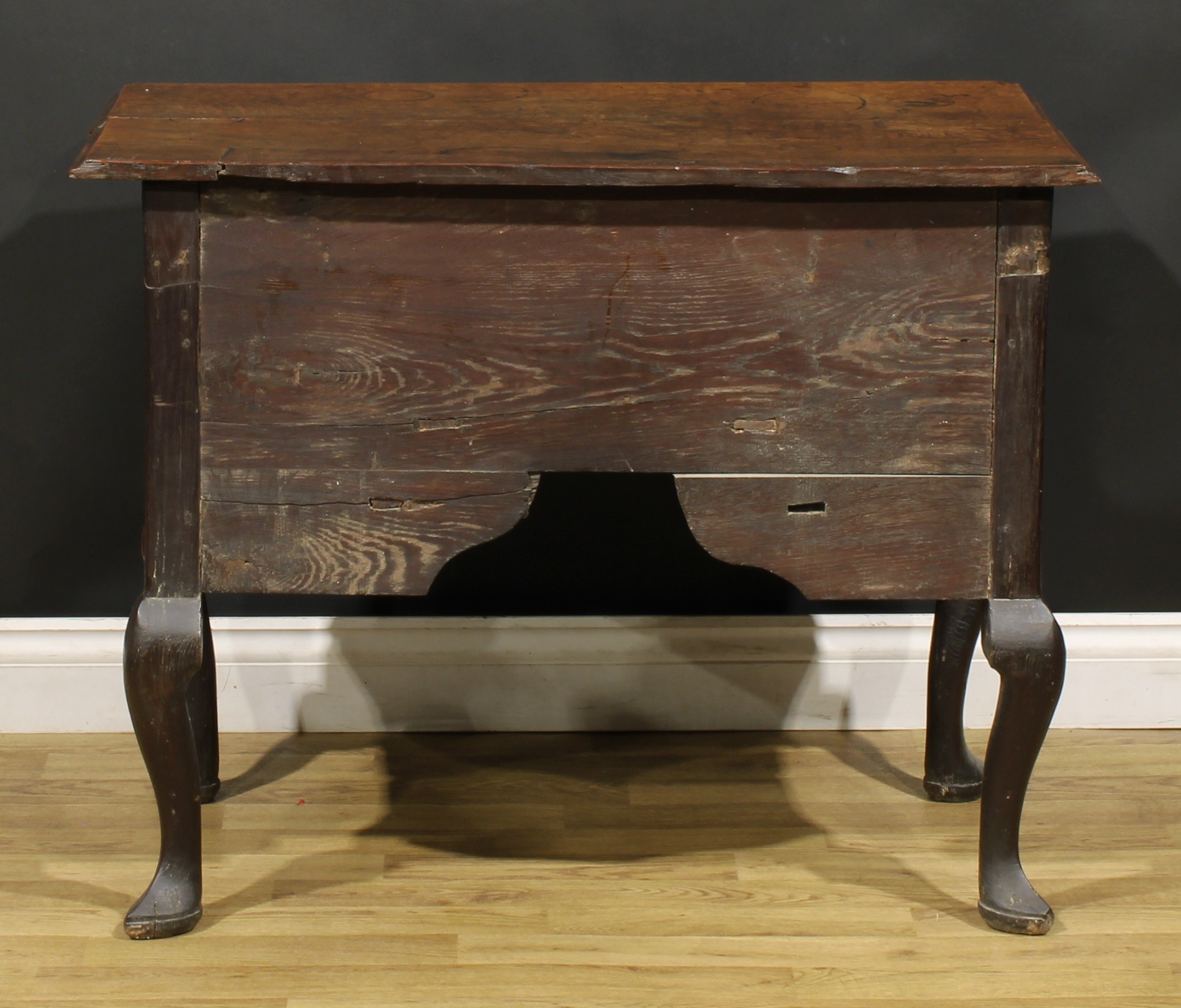 An 18th century oak lowboy, rectangular top with reentrant foreangles above four drawers, shaped - Image 6 of 6