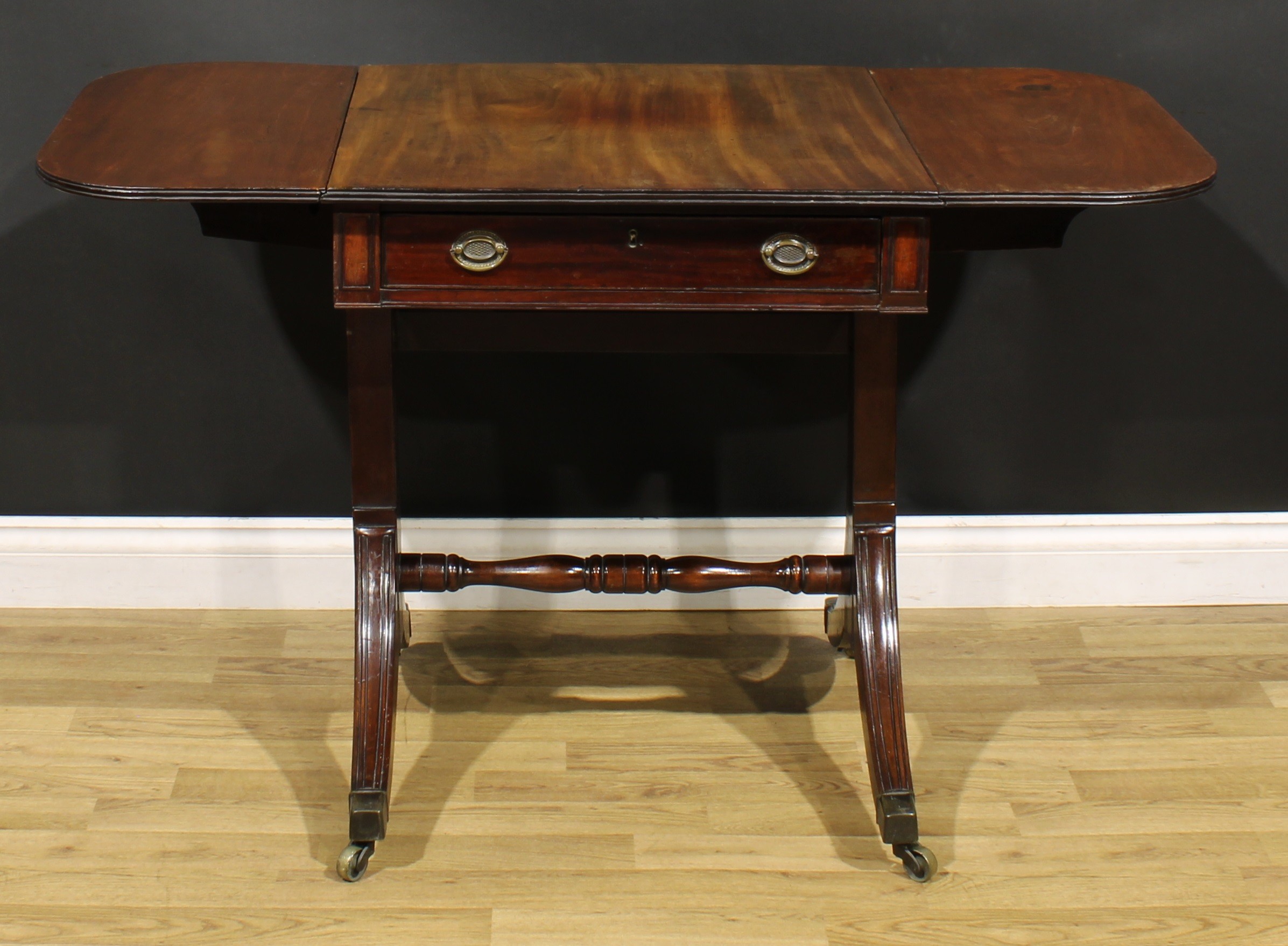 A 19th century mahogany sofa table, rounded rectangular top with fall leaves above a frieze - Image 3 of 7