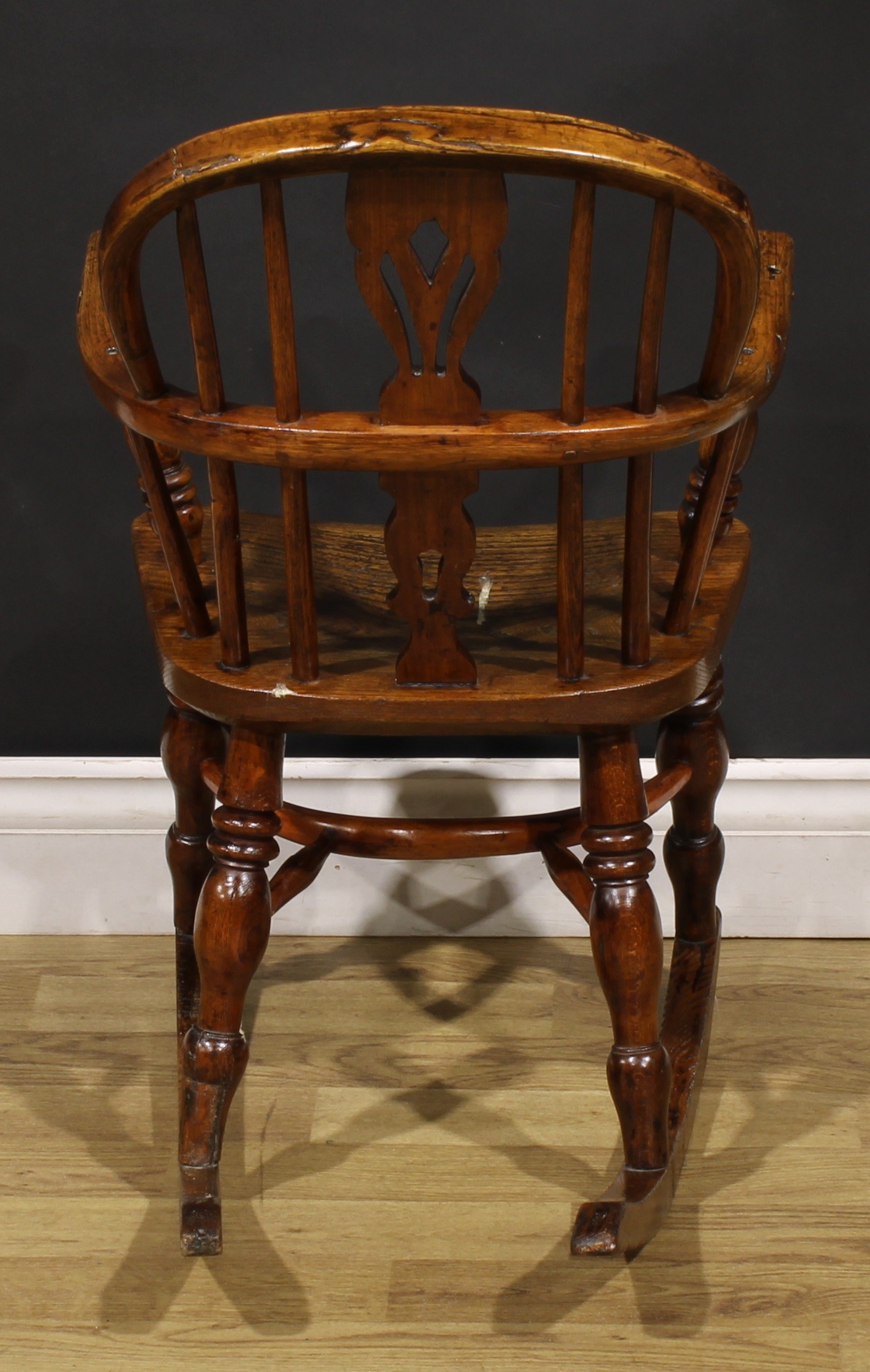 A 19th century ash and elm child’s Windsor rocking chair, pierced splat, yew crinoline stretcher, - Image 4 of 4