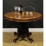 A Victorian rosewood centre table, serpentine oval tilting top, turned column carved with flower