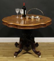 A Victorian rosewood centre table, serpentine oval tilting top, turned column carved with flower