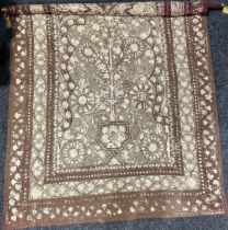 A Middle Eastern needlework wall hanging, worked with flowers and geometric motifs, 250cm x 150cm