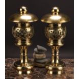 A pair of 19th century brass pagoda temple lamps, each with domed oversailing canopy above a pierced
