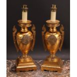 A pair of French Grecian Revival gilt bronze ovoid table lamps, cast and chased with palmettes and