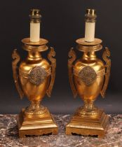 A pair of French Grecian Revival gilt bronze ovoid table lamps, cast and chased with palmettes and